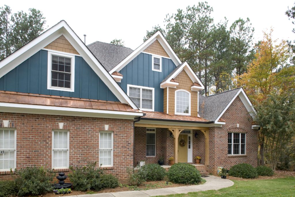 Asphalt shingle roof replacement - CertainTeed Landmark - Weathered Wood Copper Standing Seam Metal Roofing, Siding replacement and exterior painting was completing on this project.